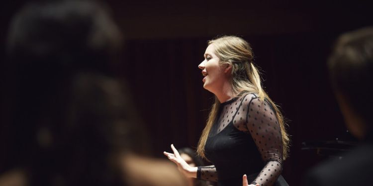 Opera student singing on stage