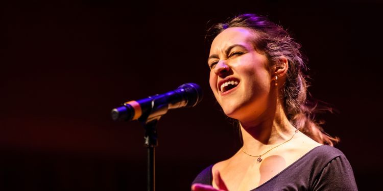 Jazz singer on stage holding a microphone