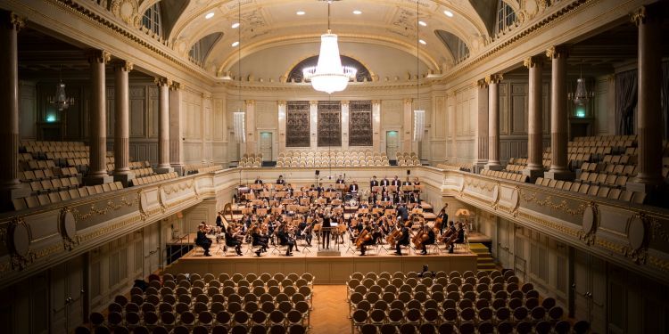 Orchestra performing in a concert hall