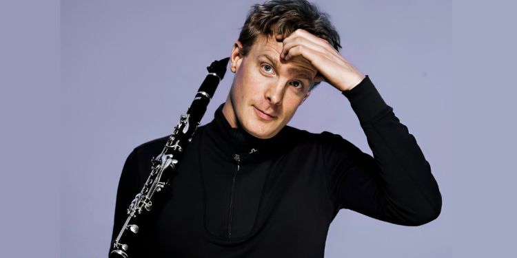 Martin Frost posing holding his clarinet