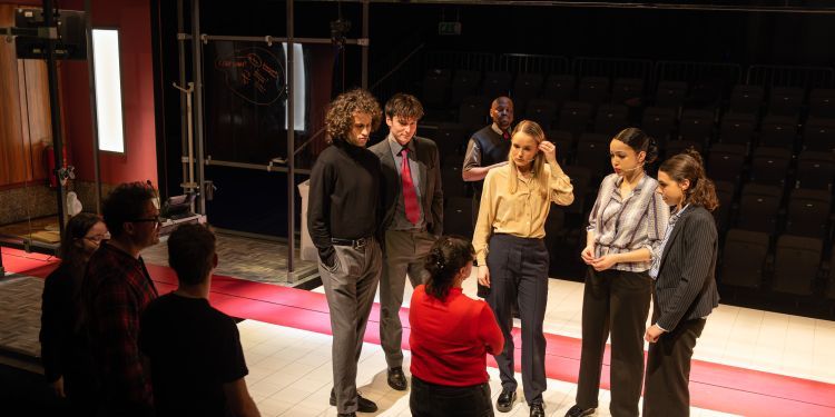 Acting and Production Arts students on stage discussing
