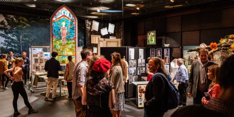 People at Graduate exhibition looks at exhibits