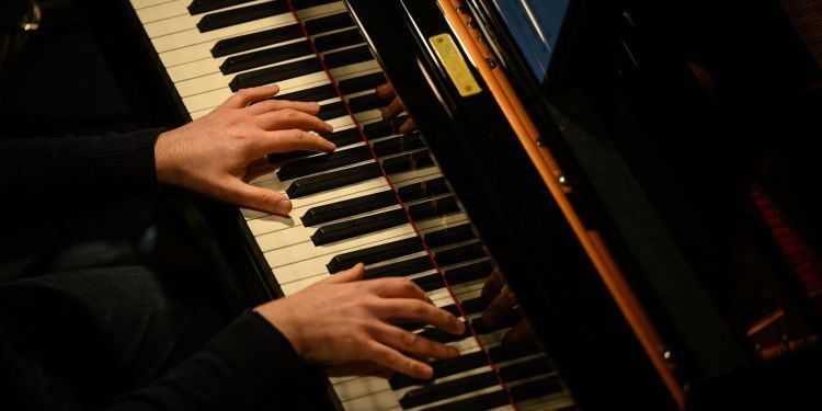 Student playing piano
