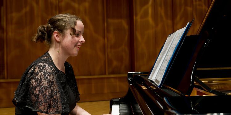 Student playing piano