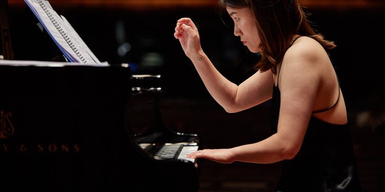 Student playing the piano