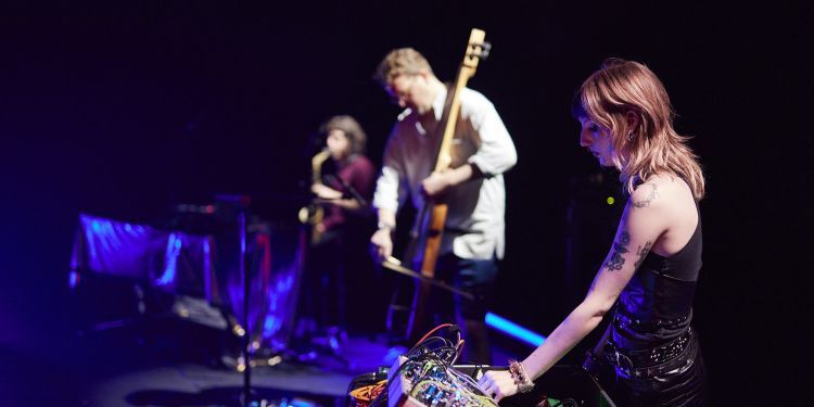 Electronic and produced music students on stage with guitar and sound desk