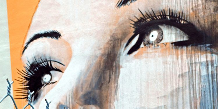 A close up of a painting of a woman's eyes