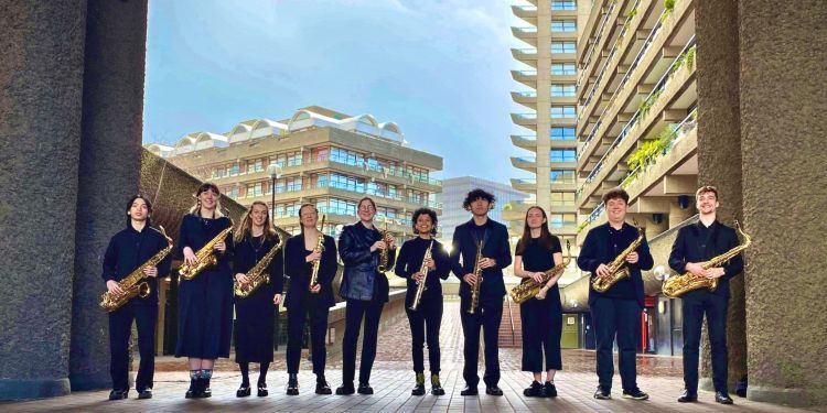 Saxophone ensemble standing by Barbican