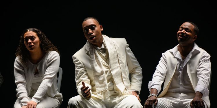 Three people in white suits