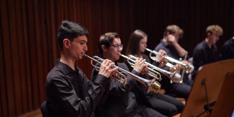 Brass students performing on stage