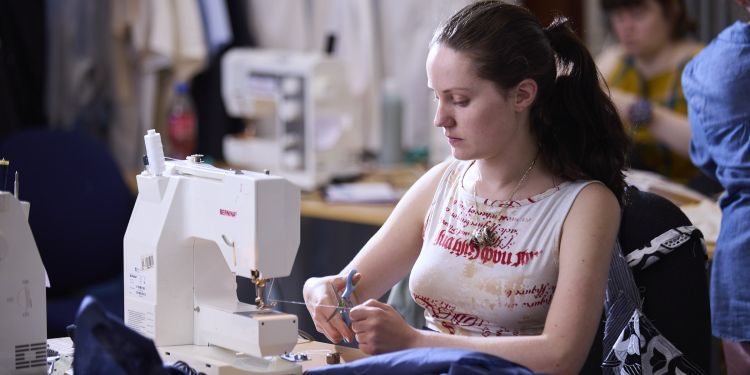 Short Courses - Summer Schools 2024 - Sewing for Beginners - Participant at Sewing Machine (Paul Cochrane)