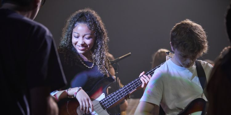 Short Courses - Summer Schools 2024 - Jazz & Rock Week - Participant playing Bass Guitar (Paul Cochrane)