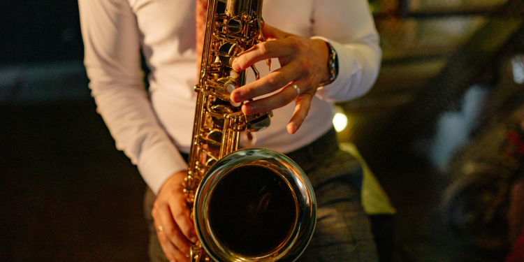 Close up of a student playing a saxophone
