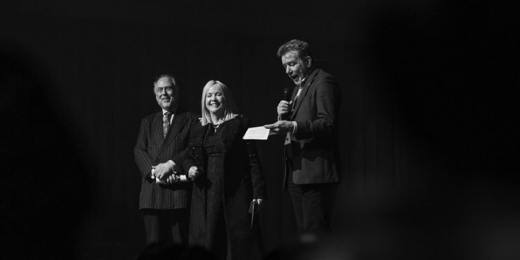 Jonathan Vaughan and Randall Anderson present Sally Greene with Fellowship