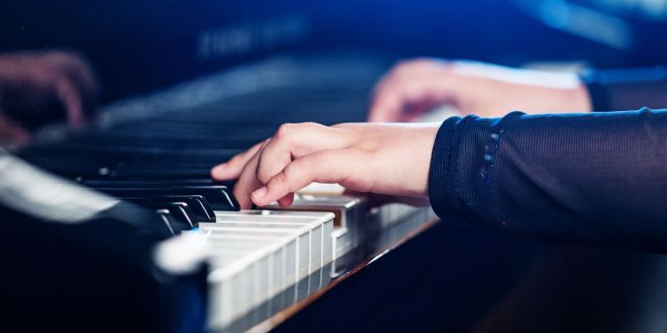 Hands playing piano