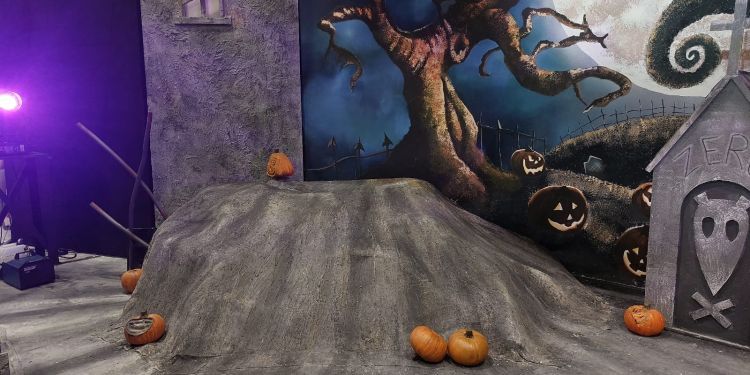 Stage set with spooky background night sky and pumpkins