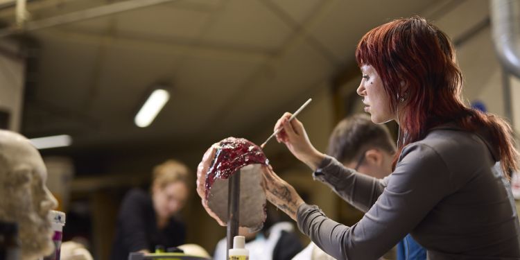 Someone painting a prop
