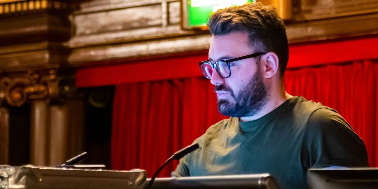 A man at a sound desk