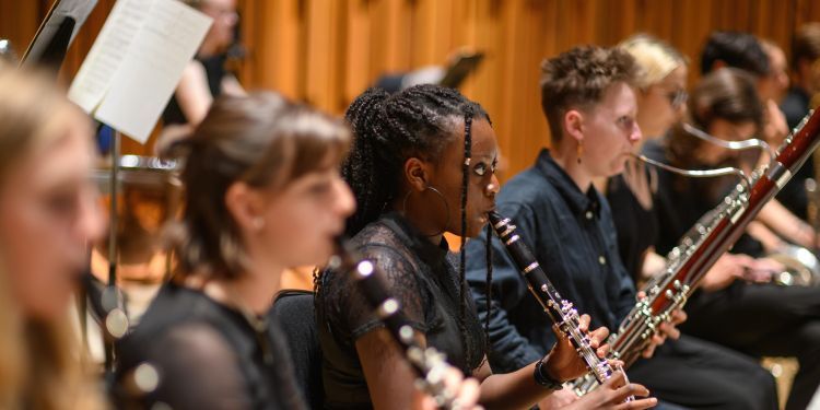 Students on stage performing as part of the LSSO