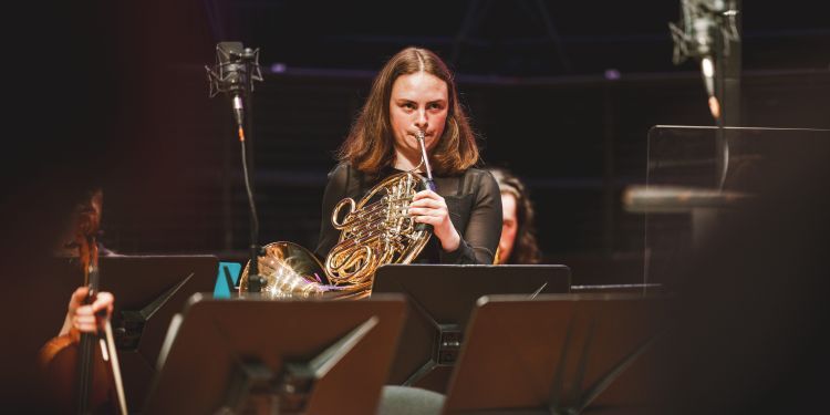 Georgina playing her horn
