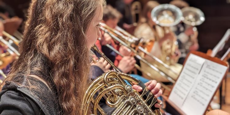 Girl playing french horn