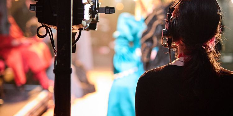 Stage Management student off stage overlooking production - Henry VIII, 2025 