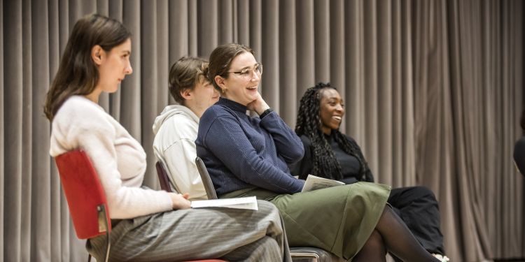 Participants laughing while watching something