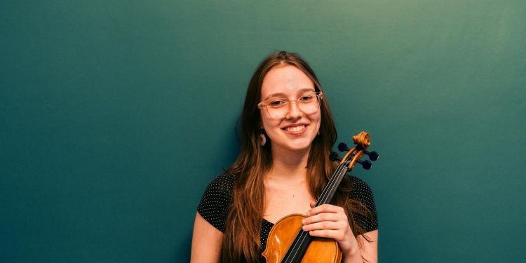 Dora posing with her violin