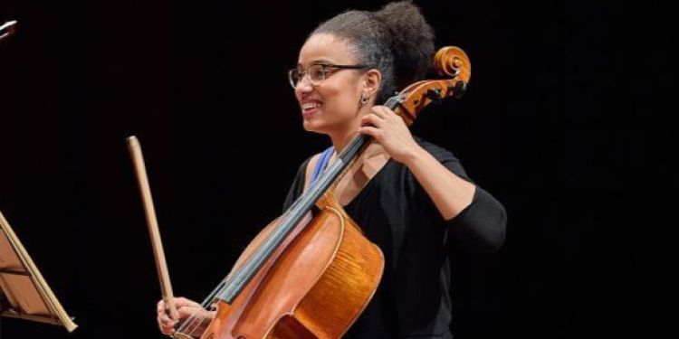 Cello student on stage laughing