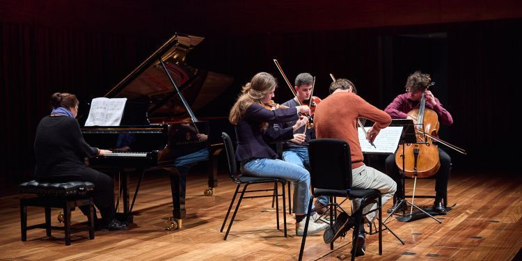 Chamber group on stage in Milton Court Concert Hall performing 
