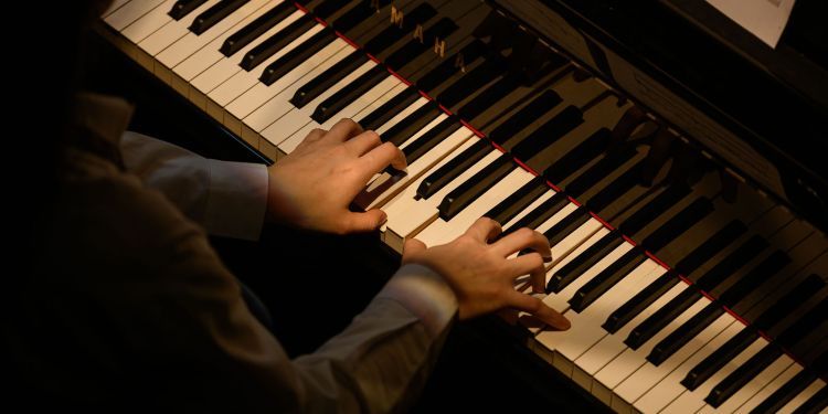 A student playing the piano 