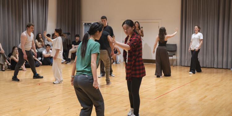 Young people taking part in an acting exercise.