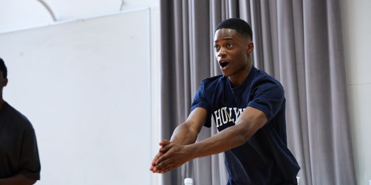 Man in action with his arms in front of him 