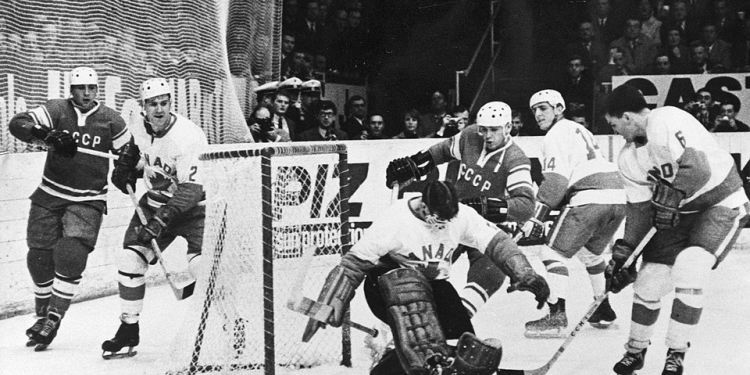 Black and white image of ice hockey players on the rink