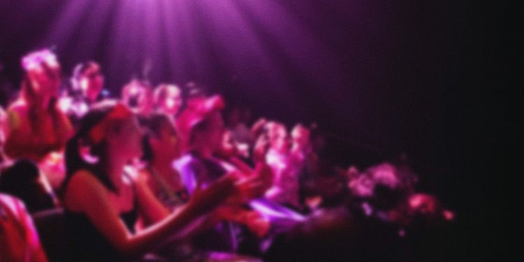 An out of focus theatre audience