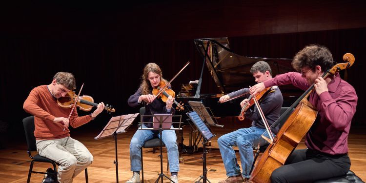 Chamber group on stage in Milton Court Concert Hall performing 