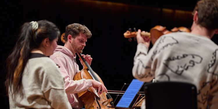 Chamber group on stage in Milton Court Concert Hall performing 