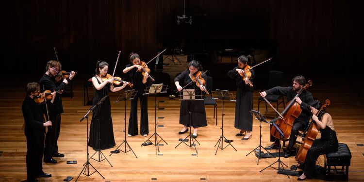 Chamber group on stage in Milton Court Concert Hall performing 