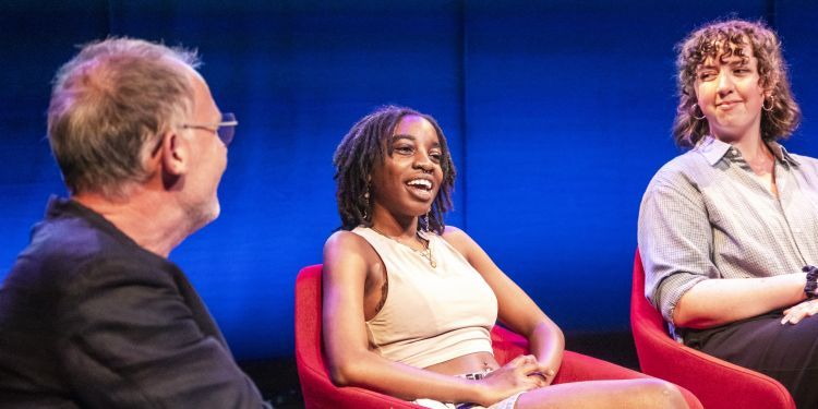 Students on stage discussing as part of the panel talk for Making It Work