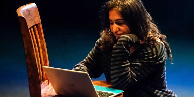 A girl works on a laptop