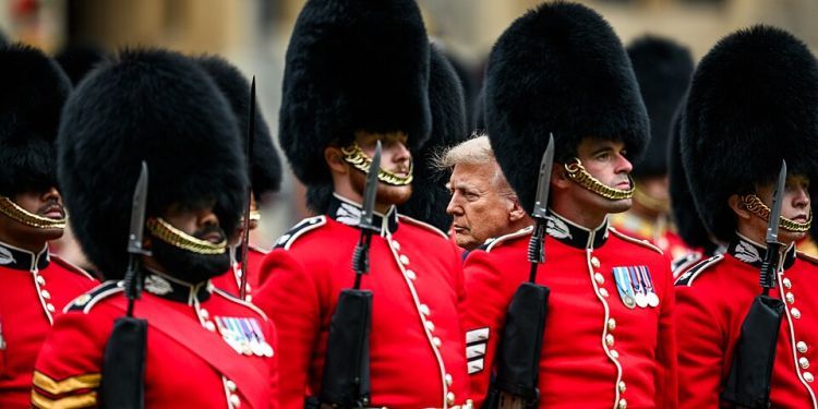 Donald trump at the centre surrounded by the kings guard beefeaters