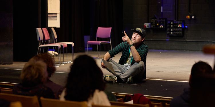 Man sitting on stage