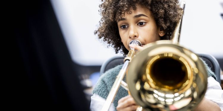 GYA Online student playing a trumpet