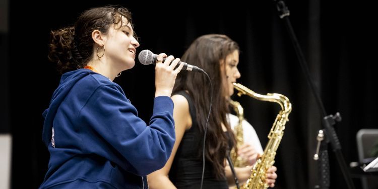 GYA Online student singing with microphone 