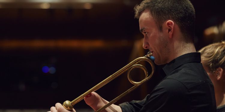 Student playing a sackbut