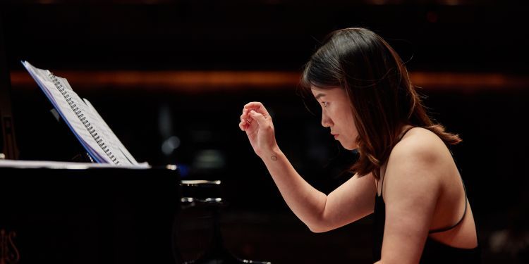 Piano student performing on stage