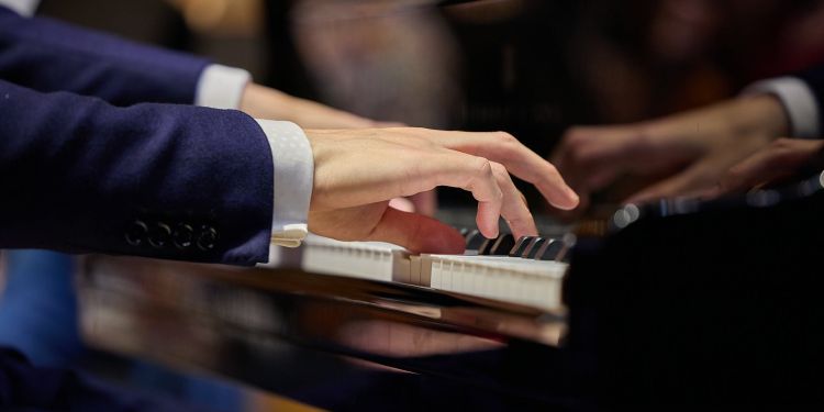 Student playing the piano