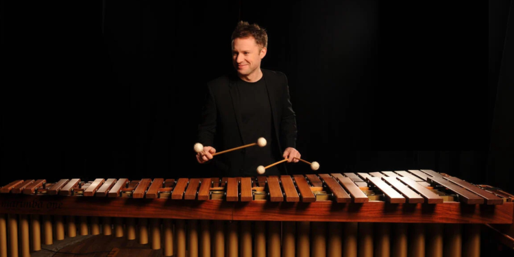 Colin Currie stood over Large xylophone ® Linda Nylind