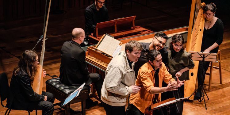 Historical music performance of a lute, harpsichord, harp and vocal ensemble on stage in Milton Court
