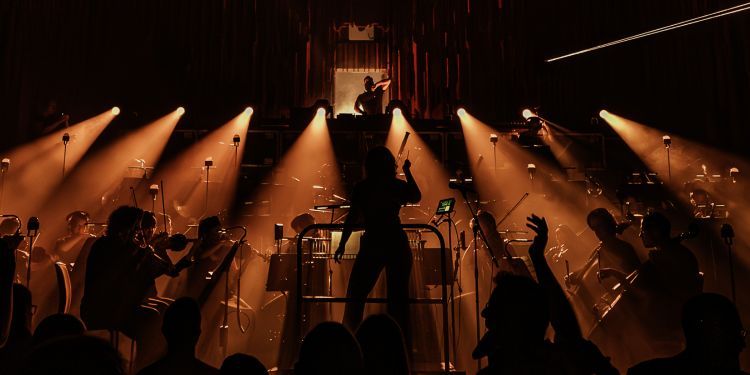 Guildhall Session Orchestra performing with strobe lighting 